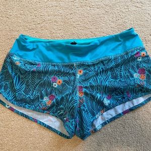 Women’s Rabbit shorts size small. 2.5 inch. Colors blue/teal/fuschia/orange.